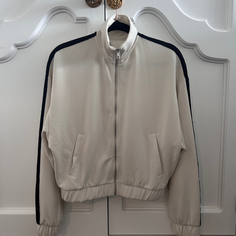 Cream Zip-Up Jacket with Black Accents